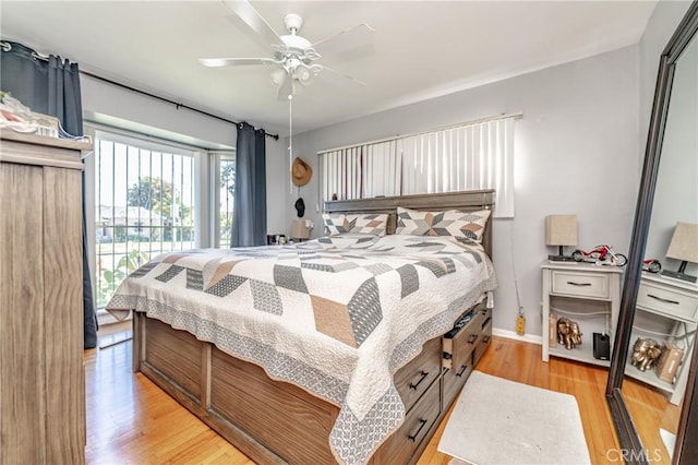 bedroom with baseboards, light wood-type flooring, and ceiling fan