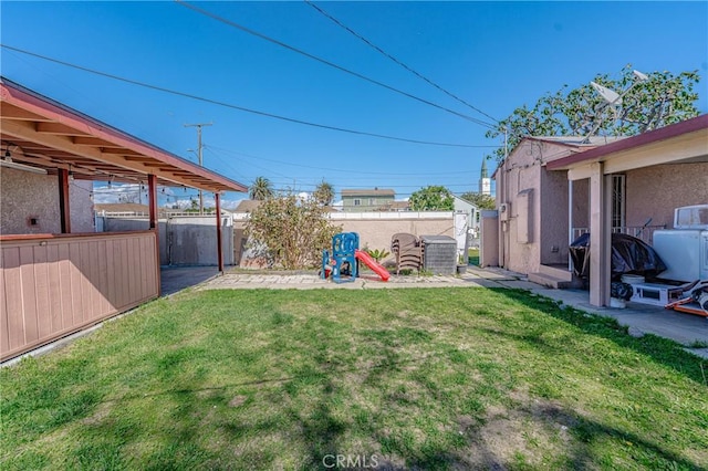 view of yard featuring a patio and a fenced backyard