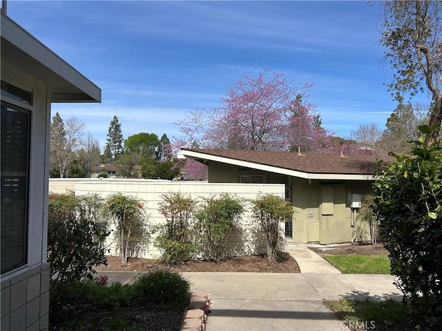 exterior space featuring stucco siding, a patio, and fence