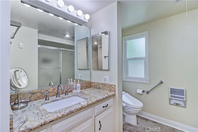 86 Calle Aragon Unit O, Laguna Woods, CA 92637 - full bathroom with a shower stall, vanity, baseboards, toilet, and heating unit