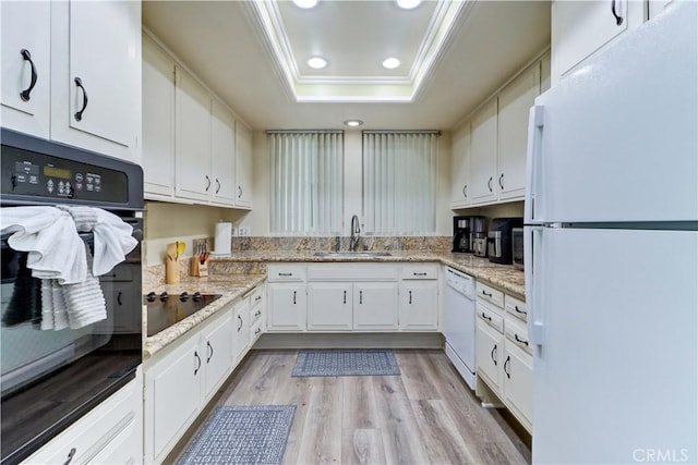 86 Calle Aragon Unit O, Laguna Woods, CA 92637 - kitchen featuring ornamental molding, recessed lighting, a raised ceiling, a sink, and black appliances