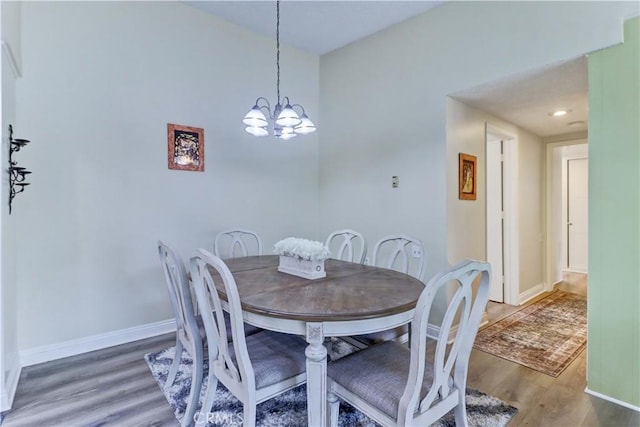 86 Calle Aragon Unit O, Laguna Woods, CA 92637 - dining space with baseboards, wood finished floors, and a notable chandelier