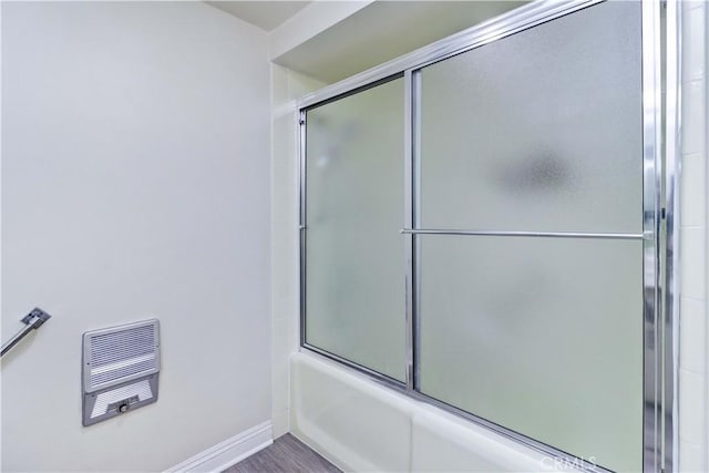86 Calle Aragon Unit O, Laguna Woods, CA 92637 - full bath with baseboards, shower / bath combination with glass door, and visible vents