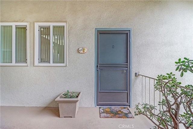 86 Calle Aragon Unit O, Laguna Woods, CA 92637 - view of exterior entry with stucco siding