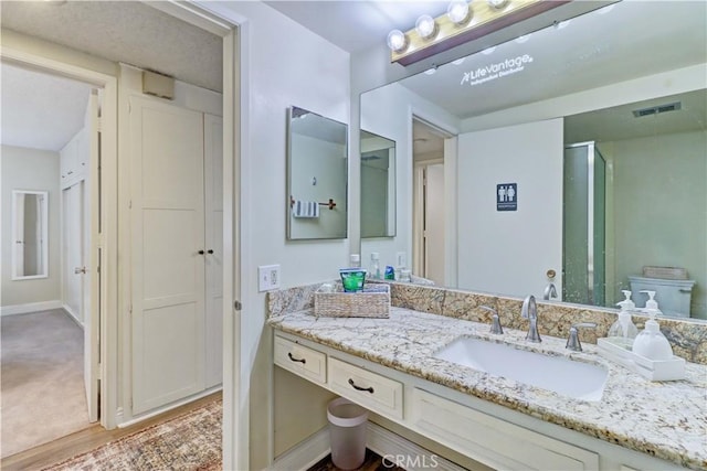 86 Calle Aragon Unit O, Laguna Woods, CA 92637 - bathroom with visible vents and vanity