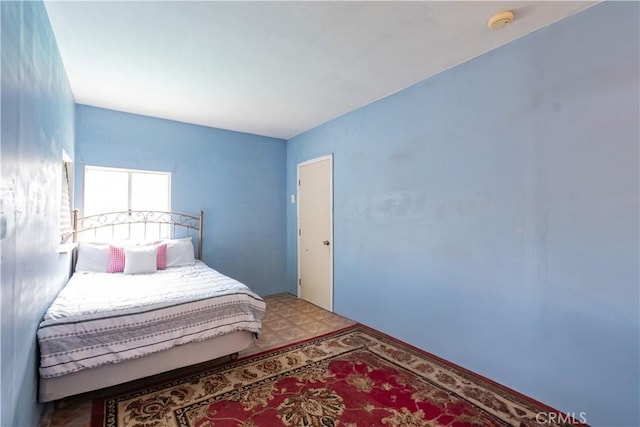 bedroom with tile patterned floors