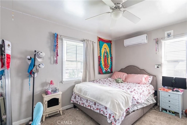 bedroom featuring ceiling fan, carpet flooring, baseboards, and a wall mounted AC