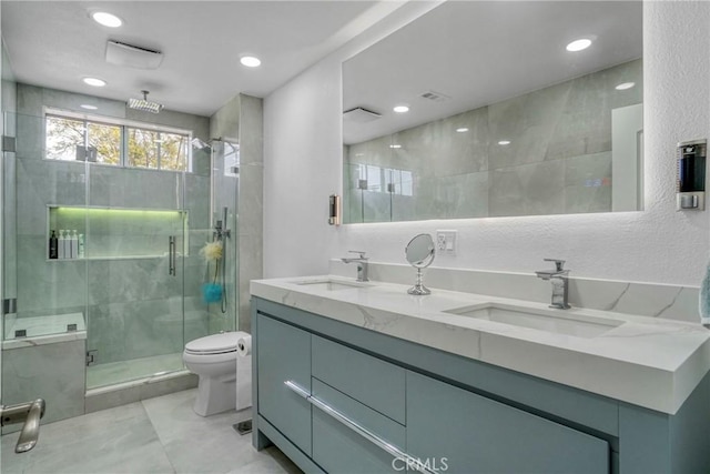 18429 Germain St, Porter Ranch, CA 91326 - full bathroom featuring double vanity, a shower stall, toilet, recessed lighting, and tile patterned floors