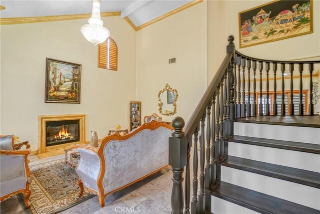 18429 Germain St, Porter Ranch, CA 91326 - stairs with a glass covered fireplace, beam ceiling, ornamental molding, and high vaulted ceiling