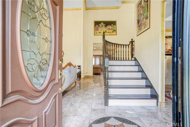 18429 Germain St, Porter Ranch, CA 91326 - foyer with stairs, marble finish floors, and baseboards