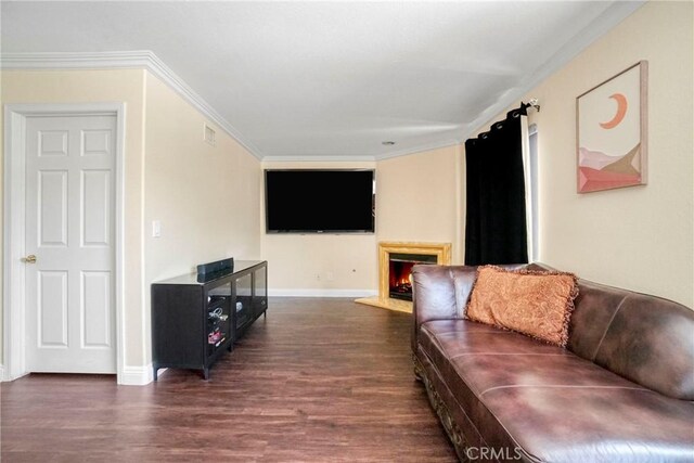 18429 Germain St, Porter Ranch, CA 91326 - living area featuring dark wood-type flooring, crown molding, baseboards, and a warm lit fireplace