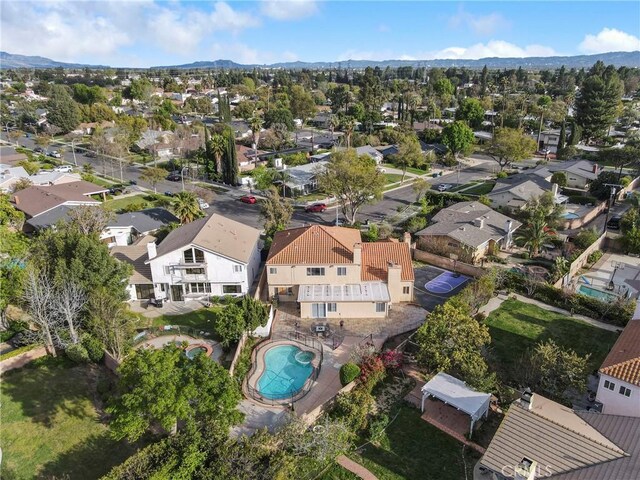 18429 Germain St, Porter Ranch, CA 91326 - aerial overview of property's location featuring nearby suburban area, a pool, and mountains