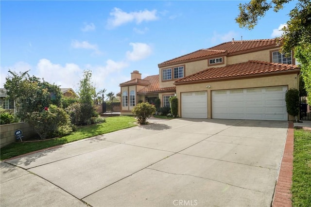 18429 Germain St, Porter Ranch, CA 91326 - mediterranean / spanish house with stucco siding, an attached garage, concrete driveway, a chimney, and a tile roof