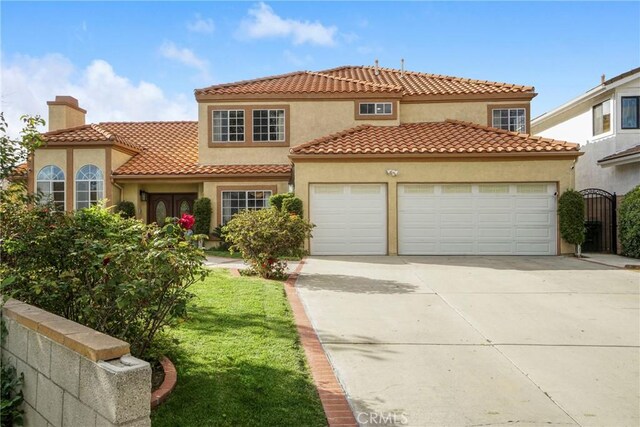 18429 Germain St, Porter Ranch, CA 91326 - mediterranean / spanish house with an attached garage, driveway, stucco siding, a chimney, and a tile roof