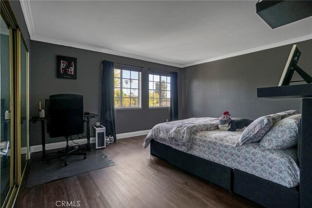 18429 Germain St, Porter Ranch, CA 91326 - bedroom featuring ornamental molding, dark wood finished floors, and baseboards