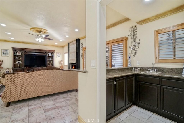 18429 Germain St, Porter Ranch, CA 91326 - kitchen featuring a sink, open floor plan, a fireplace, a ceiling fan, and healthy amount of natural light