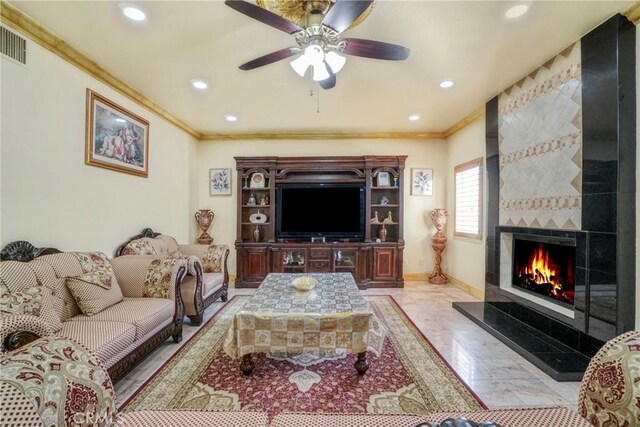 18429 Germain St, Porter Ranch, CA 91326 - living area with crown molding, a fireplace, recessed lighting, and a ceiling fan