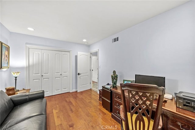 office with recessed lighting, wood finished floors, and visible vents