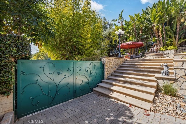 exterior space with stairs and a patio area