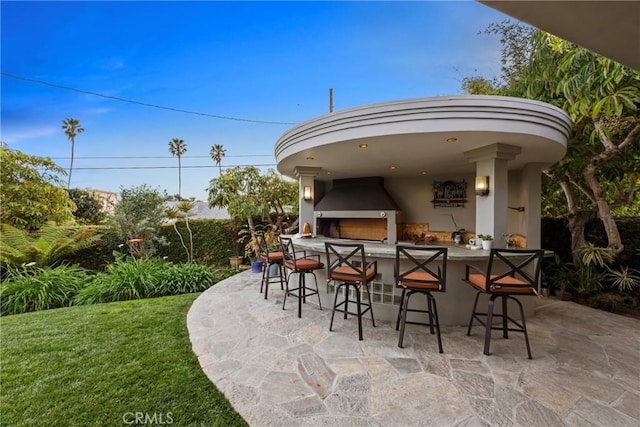 view of patio with an outdoor bar