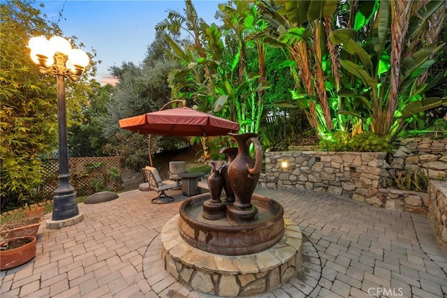 view of patio featuring fence