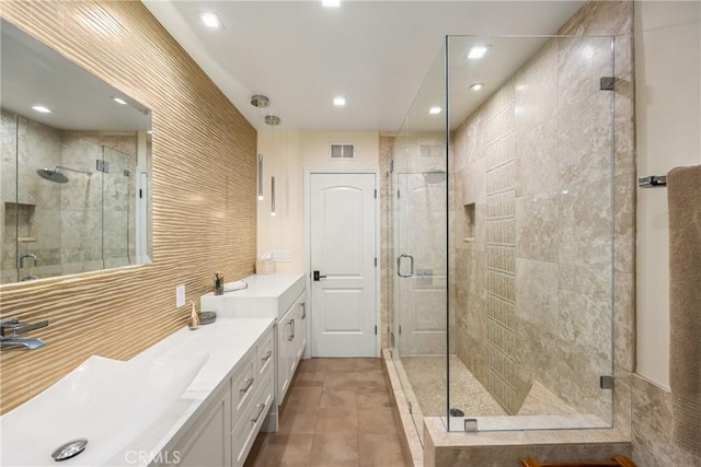 bathroom with vanity, visible vents, recessed lighting, a stall shower, and tile patterned floors