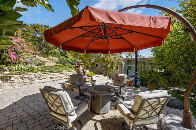 view of patio / terrace featuring a fire pit