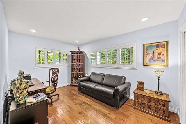 office area with recessed lighting, light wood-style floors, and baseboards