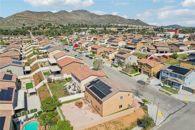 birds eye view of property with a mountain view and a residential view