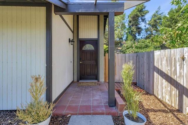 entrance to property featuring fence