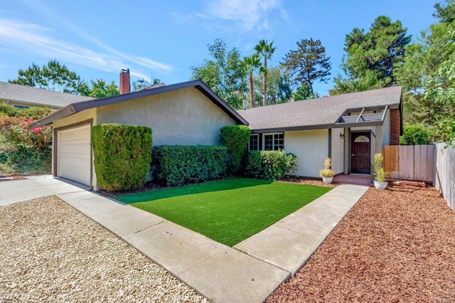 ranch-style house with a garage, driveway, a front lawn, and fence