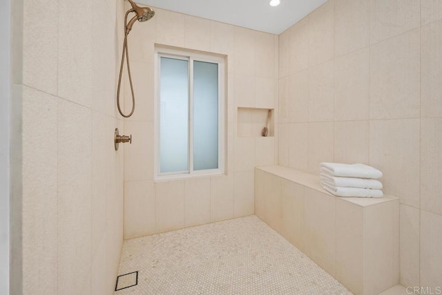 full bath featuring tiled shower