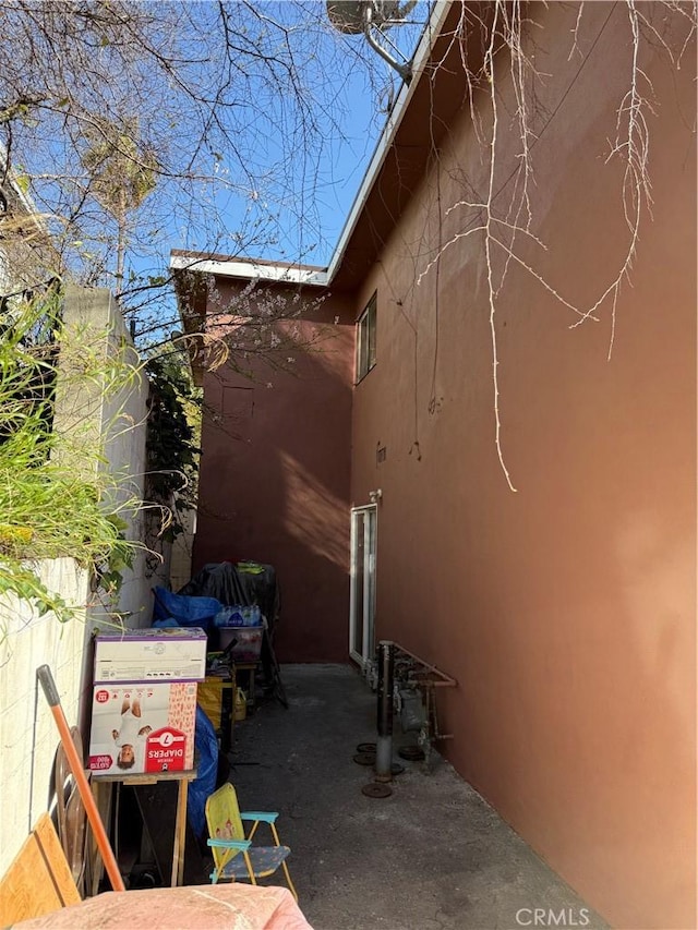 view of side of home featuring stucco siding