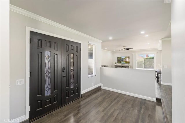 foyer entrance featuring recessed lighting, dark wood-type flooring, baseboards, and ornamental molding