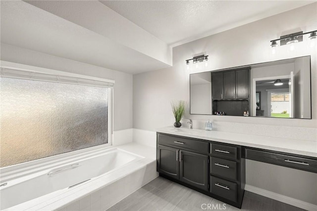 bathroom featuring vanity and a garden tub