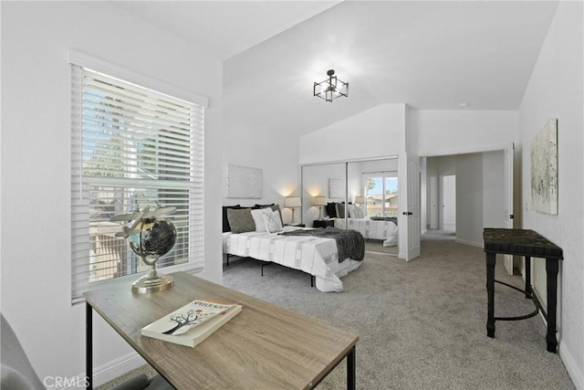 carpeted bedroom featuring vaulted ceiling and a closet