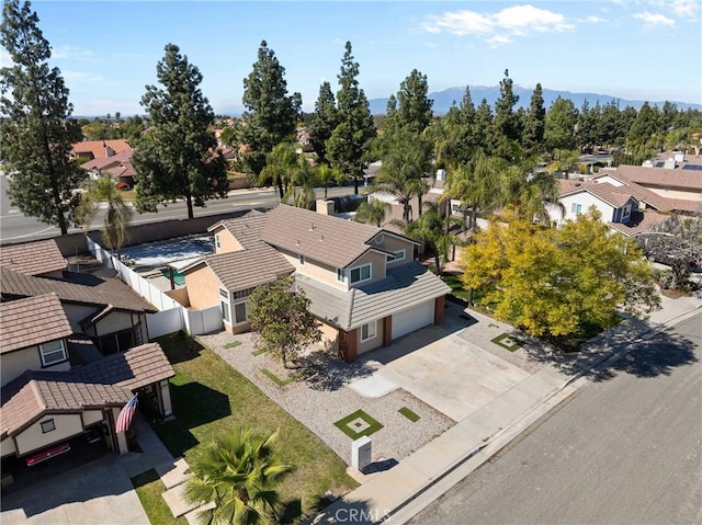 birds eye view of property with a mountain view and a residential view