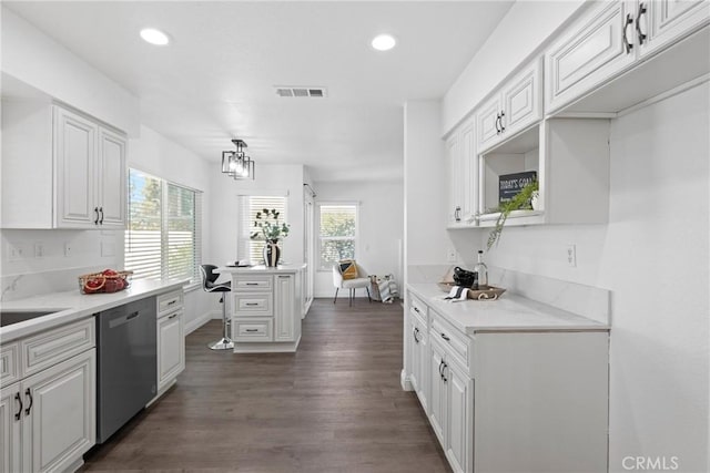 kitchen with visible vents, recessed lighting, stainless steel dishwasher, white cabinets, and dark wood-style flooring