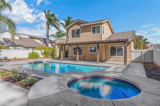 view of swimming pool featuring a fenced in pool, a patio, an in ground hot tub, and a gate