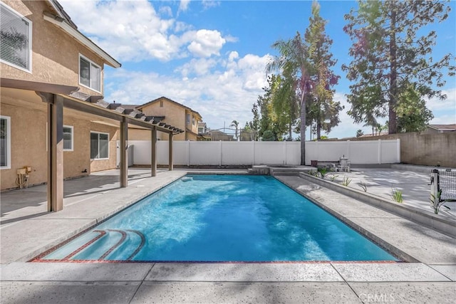 view of swimming pool with a patio area, a pergola, and a fenced backyard