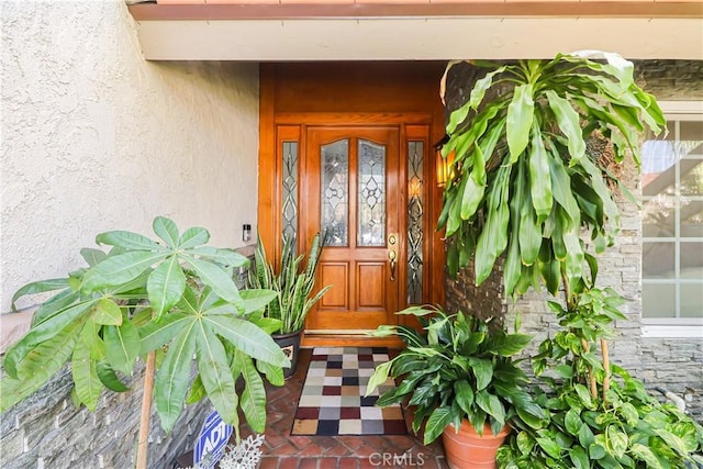 entrance to property with stucco siding