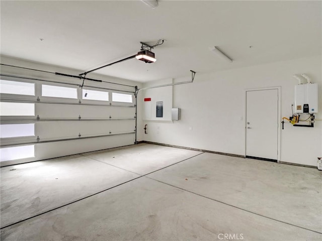 garage with electric panel, a garage door opener, and tankless water heater