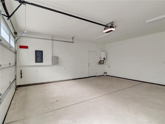 garage featuring water heater, a garage door opener, and electric panel