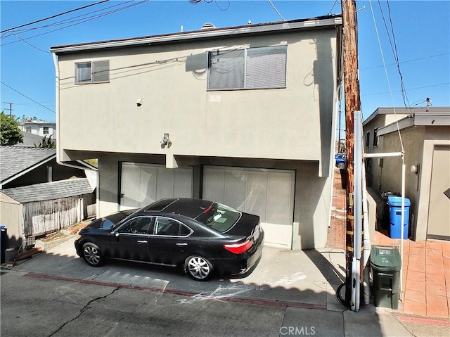 508 30th St, Hermosa Beach, CA 90254 - view of front of property with a garage, stucco siding, and driveway