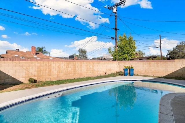 view of pool featuring a fenced in pool and a fenced backyard