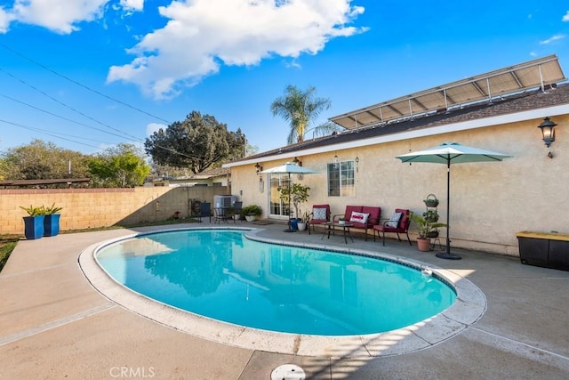 view of pool featuring a patio area, central AC unit, fence, and a fenced in pool