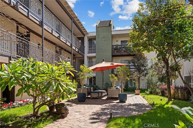 surrounding community featuring a patio