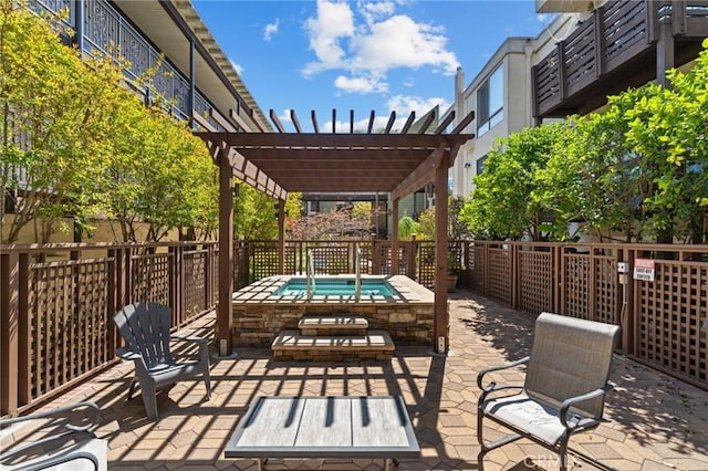 view of patio featuring a pergola, a hot tub, and a fenced backyard