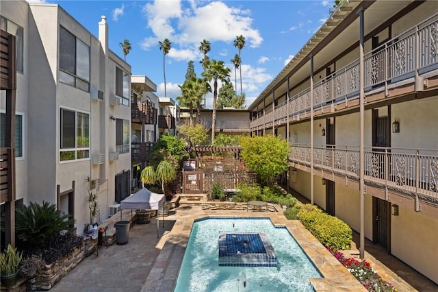 pool with a patio area