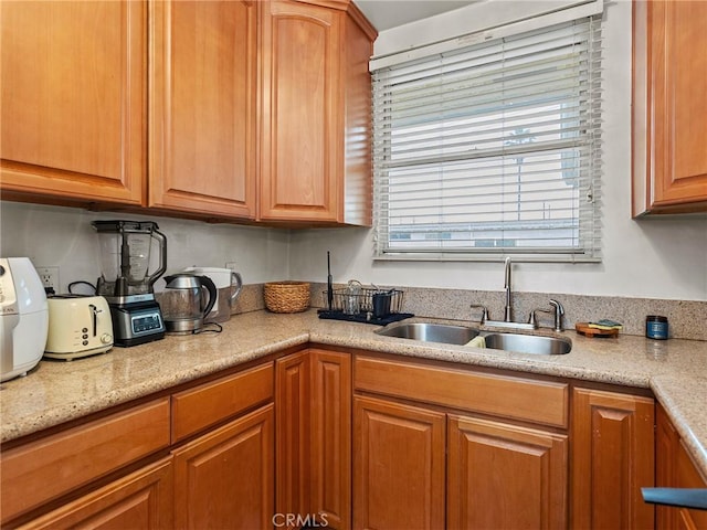 kitchen featuring a sink and light countertops